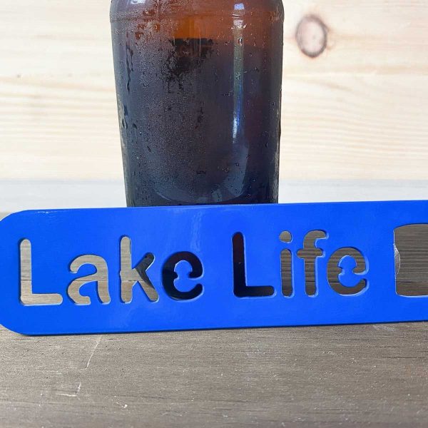Lake life bottle opener in blue leaned against a bottle