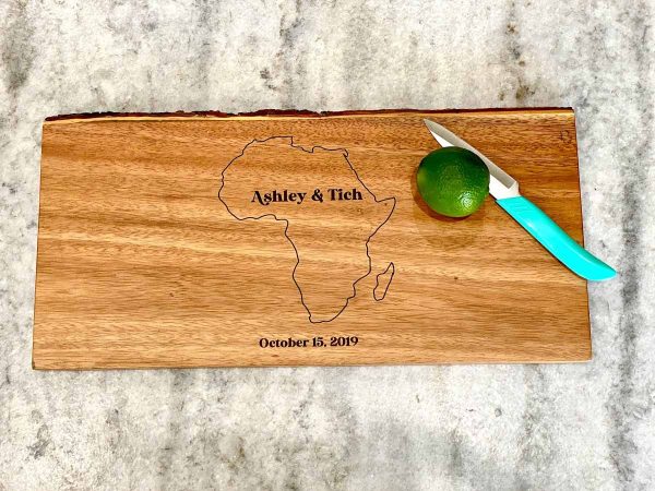 acacia wood cutting board showing an engraving of Africa