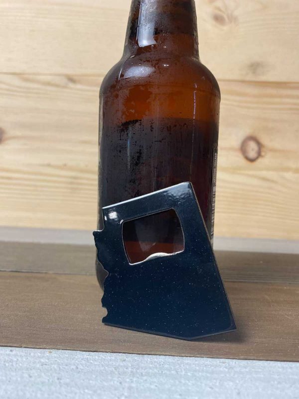 black Arizona bottle opener leaning against a bottle