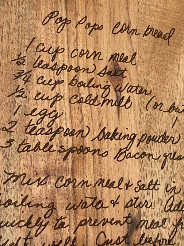 close up of handwritten engraved recipe board