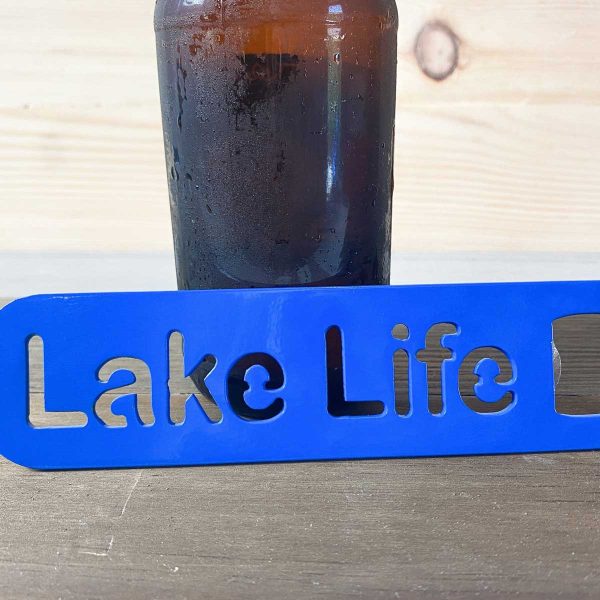 close up of blue paddle bottle opener with beer bottle, says Lake Life