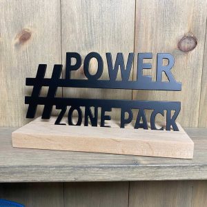 close up of metal power zone pack sign, painted black matte